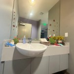 Bathroom photo. Turtle decorations and stickers on the mirror and on the counter